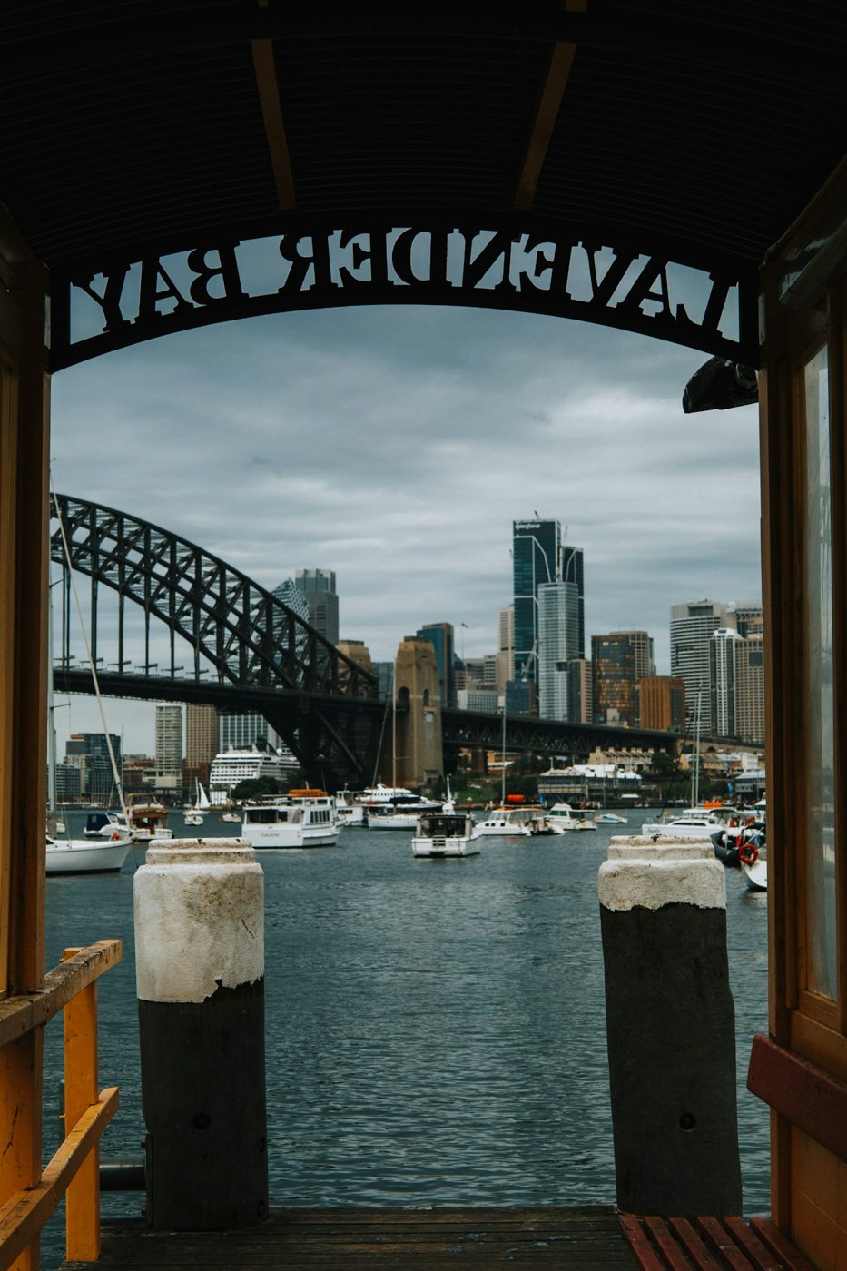 Sydney Harbour Bridge seen from a covered ferry wharf