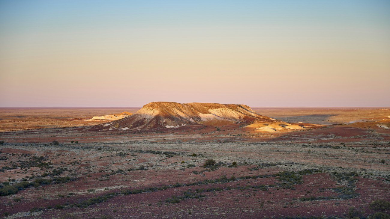 Low arid hills near Coober Pedy in evening light
