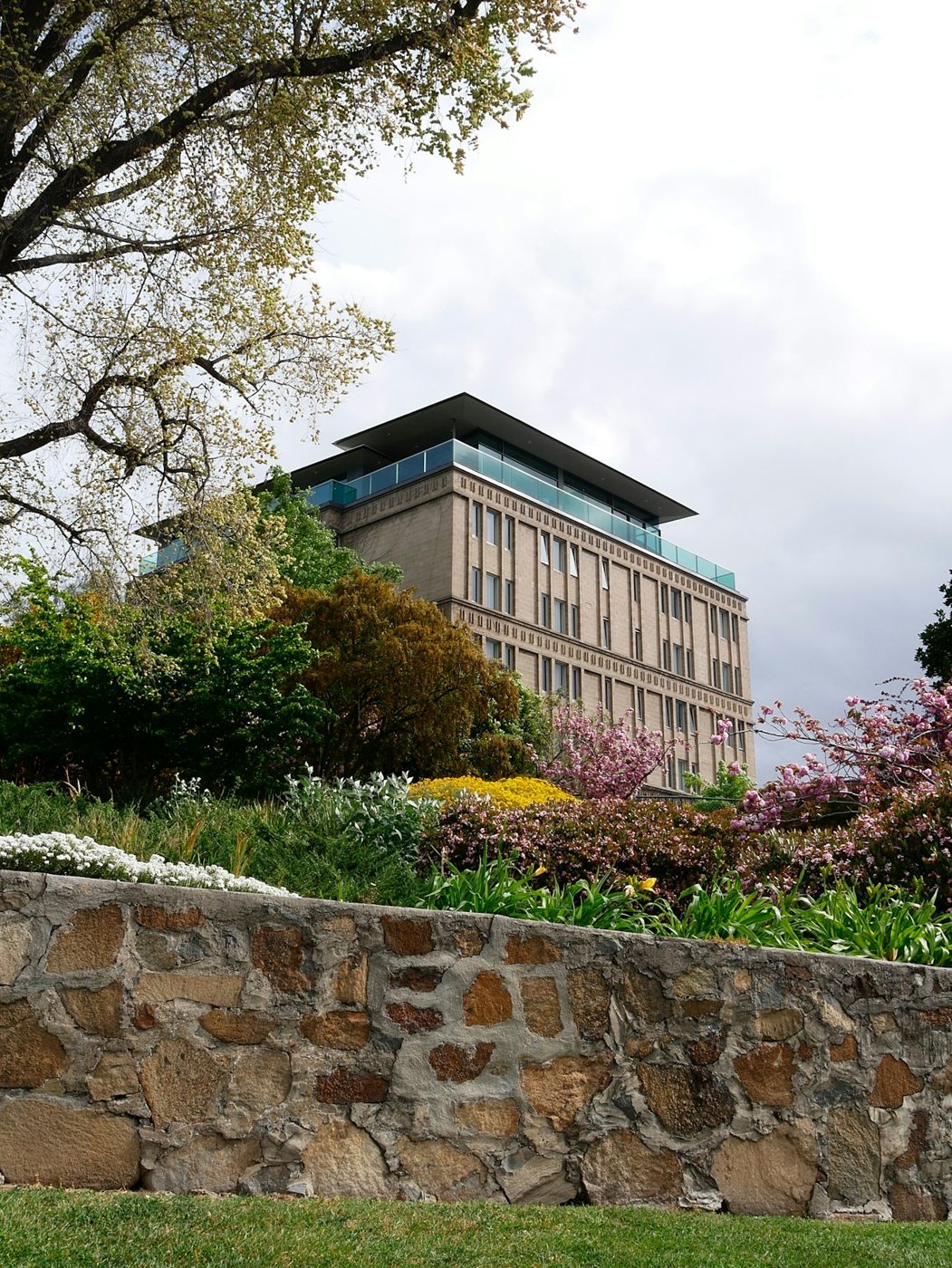 A stone wall and garden outside a Hobart hotel