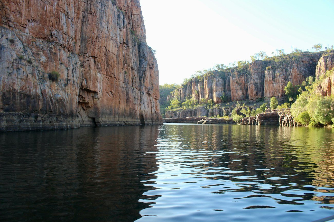 Still water between the sandstone walls of Nitmiluk Gorge